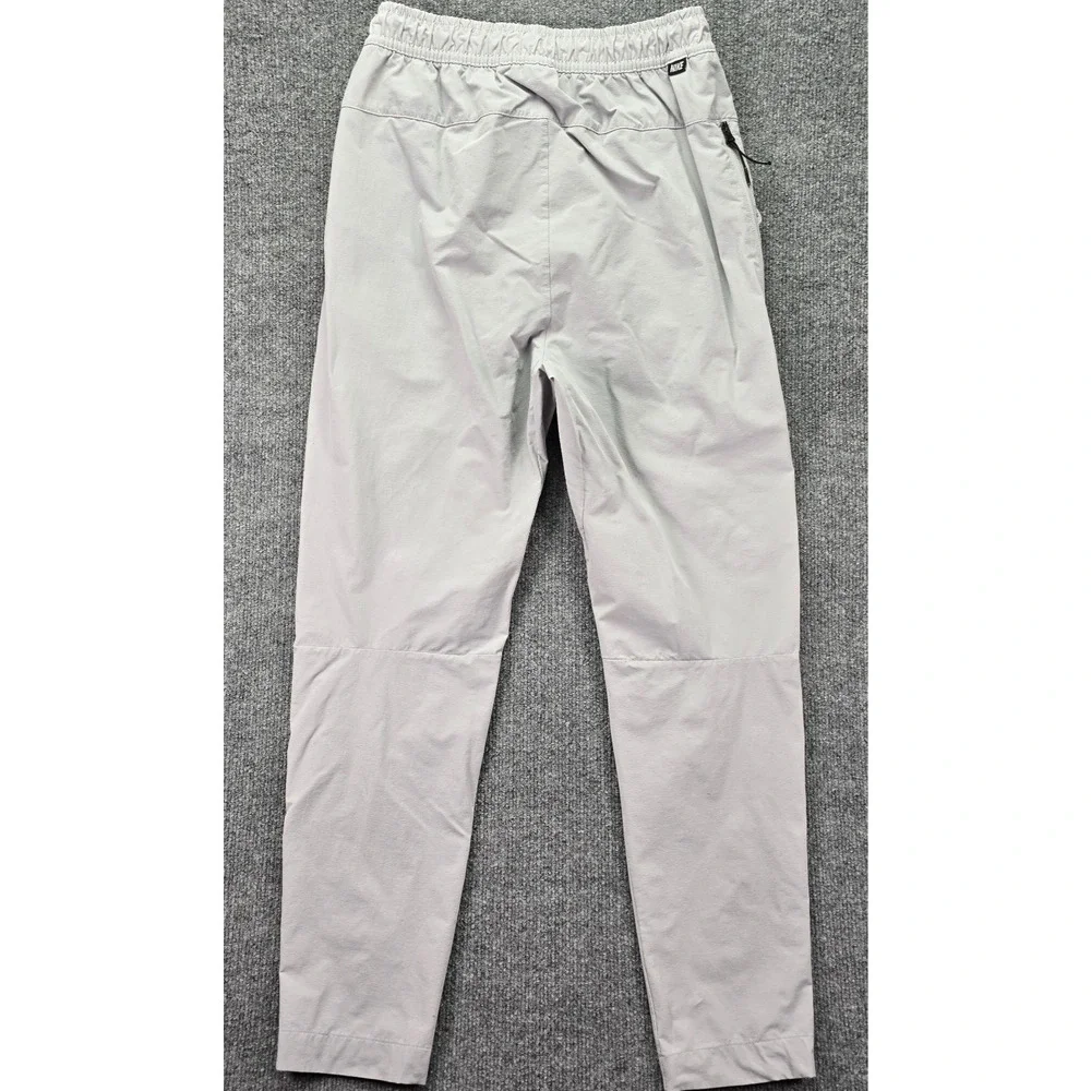 Nike Sportwear Woven Commuter Pants Mens Small Gray Tech Tapered Drawstring